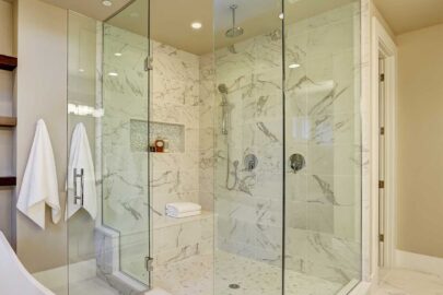 Amazing master bathroom with large glass marble walk-in shower, freestanding tub and skylights on the ceiling. Northwest, USA